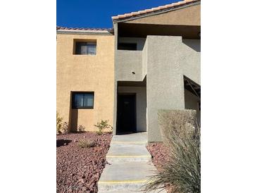 Charming townhome featuring a private entrance and neutral exterior paint at 3151 Soaring Gulls Dr # 1053, Las Vegas, NV 89128