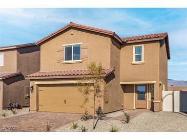 Charming two-story home featuring a classic stucco facade and a red tile roof at 4211 Gold Desert St, North Las Vegas, NV 89032