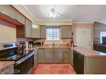 Traditional kitchen featuring painted cabinets, stainless steel appliances, and terracotta tile flooring at 2725 S Nellis Blvd # 2179, Las Vegas, NV 89121