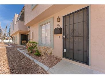 Charming townhome featuring desert landscaping, a secure gated entry, and a private mailbox at 5939 Vegas Dr, Las Vegas, NV 89108