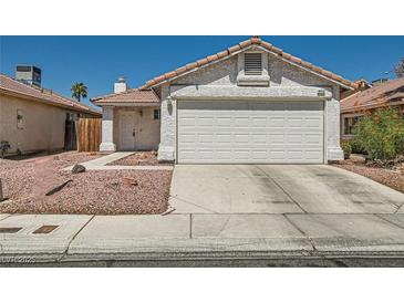 Charming single-Gathering home featuring a two-car garage, stucco exterior and a tile roof at 6412 Yarmouth Dr, Las Vegas, NV 89108