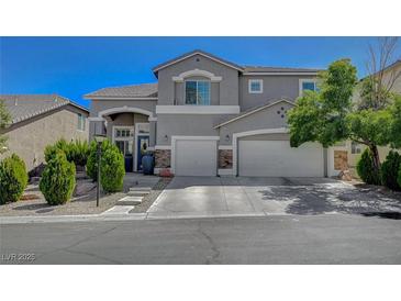 Charming two-story home featuring a two-car garage and beautifully landscaped front yard at 7905 Brent Leaf Ave, Las Vegas, NV 89131