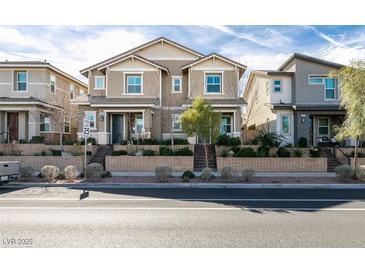 Charming two-story home boasts a well-maintained front yard and inviting curb appeal at 712 N Water St, Henderson, NV 89015