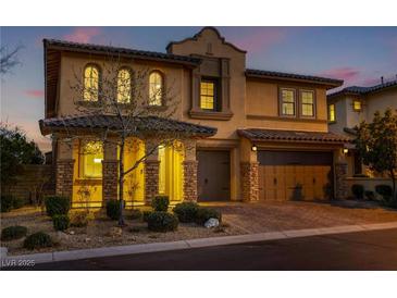 Charming two-story home boasts a three-car garage, well-manicured landscaping, and beautiful architectural details at 12279 Lost Treasure Ave, Las Vegas, NV 89138