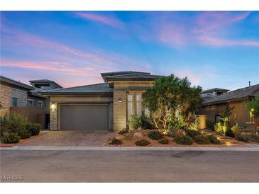 Charming single-story home with well-maintained landscaping and attached garage at 12374 Skyracer Dr, Las Vegas, NV 89138