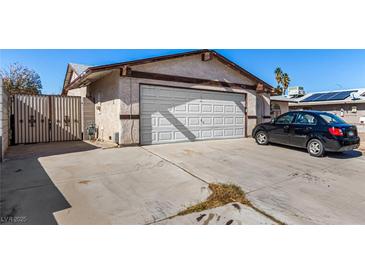 Charming single-story home with a two-car garage and long driveway on a sunny day at 2712 Rialto Rd, Las Vegas, NV 89108