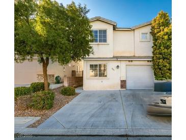 Charming two-story home with well maintained lawn, mature tree, and wide driveway at 2049 Audrey Hepburn St, Las Vegas, NV 89142