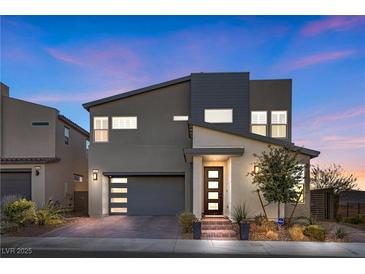 Modern two-story home with contemporary design elements and a well-manicured front yard at 2493 Verdello St, Henderson, NV 89044