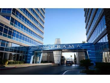 A striking entrance to the Panorama building, adorned with blue accents and sleek architectural design at 4515 Dean Martin Dr # 201, Las Vegas, NV 89103