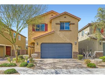 Charming two-story home with landscaped yard and a two-car garage in a residential neighborhood at 6629 Breakwater Reef St, Las Vegas, NV 89149