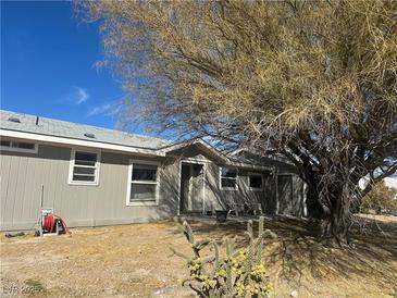 Charming single-story house with desert landscaping, offering a peaceful and private setting at 1640 E Kearney St, Pahrump, NV 89048
