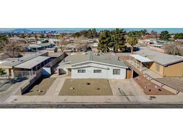 Modest single-story home with desert landscaping and a concrete driveway at 173 Betty Ln, Las Vegas, NV 89110
