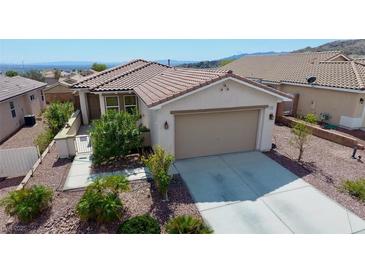 Charming single-story home with tile roof, desert landscaping, and inviting curb appeal at 2351 Thornwood Castle Dr, Laughlin, NV 89029