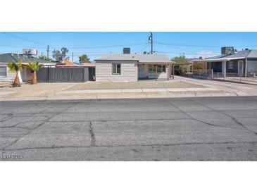 Charming single-story home featuring a covered front porch and low-maintenance landscaping at 457 Federal St, Henderson, NV 89015