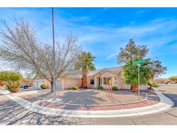 Charming single story home with desert landscaping and a welcoming, covered entryway at 1035 Dodger Blue Ave, Las Vegas, NV 89123