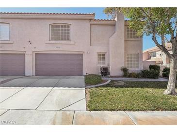 Charming two-story home with a well-maintained lawn and a two-car garage, perfect for suburban living at 513 Rafkin Pl, Henderson, NV 89052