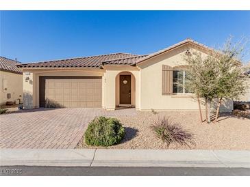 Charming single-story home with a well-manicured front yard, covered entryway, and two car garage at 6156 Ava Ridge Ave, Las Vegas, NV 89141