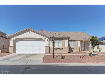 Charming single-story home featuring a two-car garage and low-maintenance landscaping at 832 Vineyard Vine Way, North Las Vegas, NV 89032