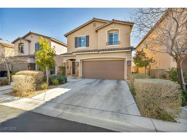 Charming two-story home with a well-manicured lawn, a spacious driveway, and a two-car garage at 854 Earth Luster Rd, Las Vegas, NV 89178