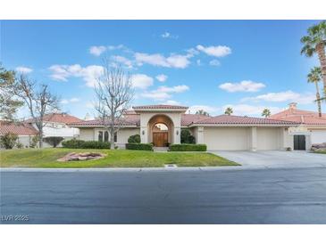 Charming single story home with well-manicured lawn and inviting red tile roof at 8701 Robinson Ridge Dr, Las Vegas, NV 89117