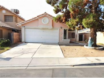 Charming single-story home with a two-car garage and a well-maintained front yard at 1253 Finale Ln, Las Vegas, NV 89119