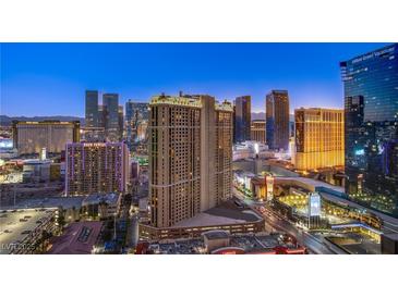 Striking Las Vegas city view with glittering lights at dusk from a high-rise condo unit at 135 E Harmon Ave # 2821, Las Vegas, NV 89109