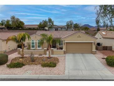 Charming single-story home with a two car garage and desert landscaping at 1616 Langston Hughes St, Henderson, NV 89052