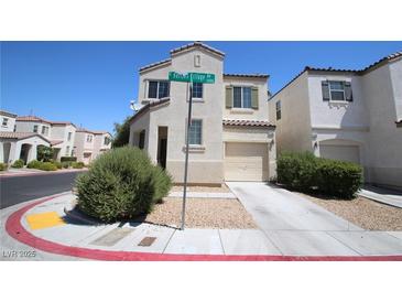 Charming two-story home with a two-car garage and desert landscaping at 1286 Horizon Village Ave, Las Vegas, NV 89183