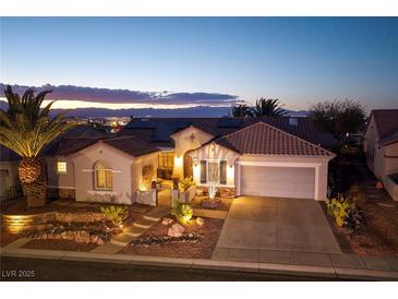 Charming single-story home with desert landscaping, a tile roof, and a two-car garage at 1657 Hartley Ave, Henderson, NV 89052