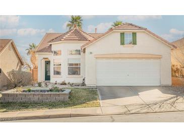 Charming single-Gathering home with a well-maintained lawn and attached two-car garage at 186 Shaded Peak St, Henderson, NV 89012