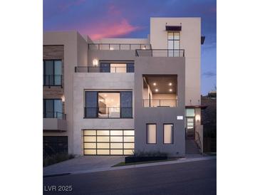 Striking contemporary home features a multi-level design, sleek lines and balcony with mountain views at 438 Serenity Point Dr, Henderson, NV 89012