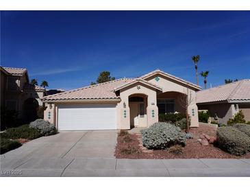 Charming single story home with desert landscaping, two car garage, and a tile roof at 9420 Water Flow Ct, Las Vegas, NV 89134