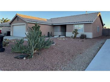 Charming single-story home featuring desert landscaping and a classic tile roof at 213 Beaver Ridge Ave, North Las Vegas, NV 89031