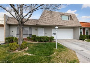 Charming one-story home with a well-maintained lawn and an attached two-car garage at 3630 Mckinley Ave, Las Vegas, NV 89121