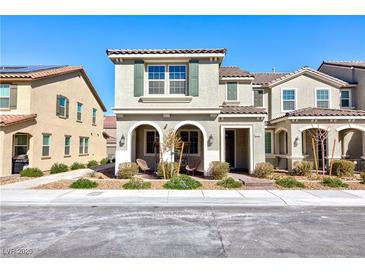 Charming two-story home featuring an arched front porch and low-maintenance landscaping at 3732 Via Gennaro, Henderson, NV 89044