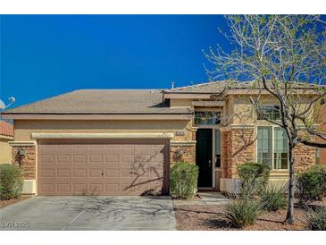 Charming single-story home with a two-car garage and well-maintained desert landscaping at 8856 Timber Mesa St, Las Vegas, NV 89139
