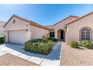 Charming single-story home featuring a low-maintenance front yard and attached two-car garage at 2253 Laurel Heights Ln, Henderson, NV 89052