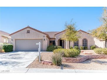 Charming single-story home with a well-manicured front yard and inviting curb appeal at 2253 Laurel Heights Ln, Henderson, NV 89052