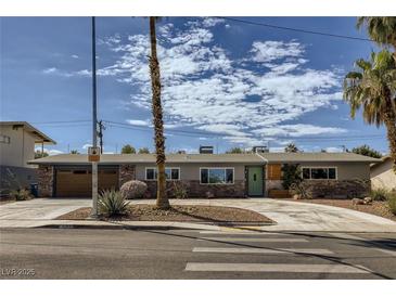 Charming single-story home with desert landscaping and a spacious driveway under a cloudy sky at 3543 Algonquin Dr, Las Vegas, NV 89169