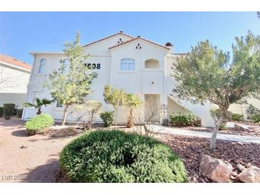 Inviting condominium building with desert landscaping and exterior staircase at 4508 W Lake Mead Blvd # 202, Las Vegas, NV 89108