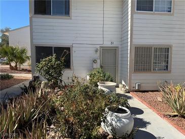 Charming two-story home with a front yard and a walkway to the front door at 4770 Topaz St # 31, Las Vegas, NV 89121