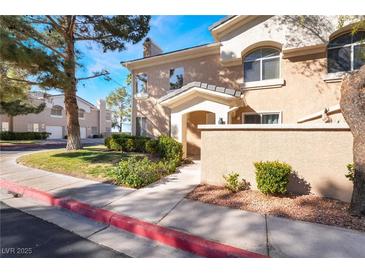 Charming townhouse featuring a welcoming entrance and well-maintained landscaping at 502 Fragrant Orchard St, Henderson, NV 89015