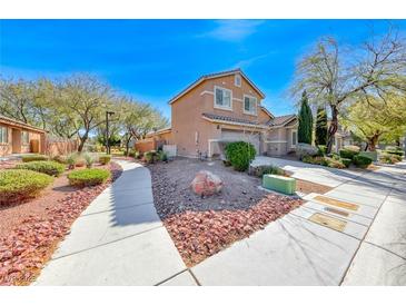 Charming two-story home with landscaped front yard and attached two-car garage at 6028 Stern Cove Ct, North Las Vegas, NV 89031