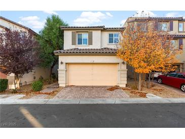 Charming two-story home with a two-car garage and a well-maintained front yard at 7253 Sterling Rock Ave, Las Vegas, NV 89178