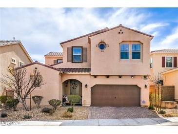 Charming two-story home features a well-maintained yard, a tile roof, and a two-car garage at 9655 Shadow Cliff Ave, Las Vegas, NV 89166