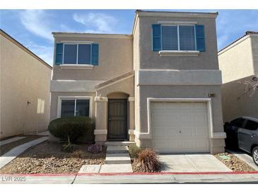 Charming two-story home featuring light stucco, teal shutters, and a one-car garage at 10047 Fine Fern St, Las Vegas, NV 89183