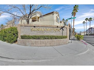 Community entrance sign for Sunhampton Private Residences under a blue sky at 3672 Angela Robin St # 206, Las Vegas, NV 89129