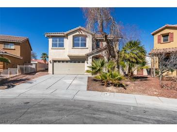 Charming two-story home with desert landscaping, neutral stucco, and two-car garage at 4141 Coburn St, North Las Vegas, NV 89032