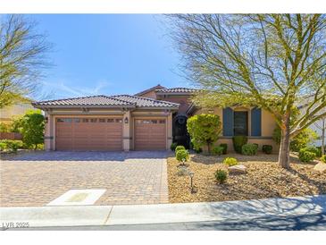 Charming single-story home with a three-car garage and well-manicured landscaping at 7763 Brisk Ocean Ave, Las Vegas, NV 89178