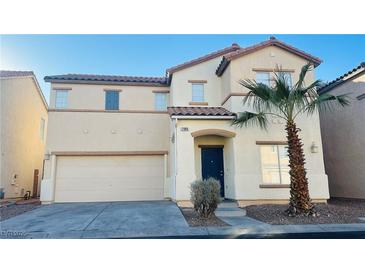 Charming two-story home featuring a landscaped yard and a convenient two-car garage at 7985 Flower Seeds St, Las Vegas, NV 89139